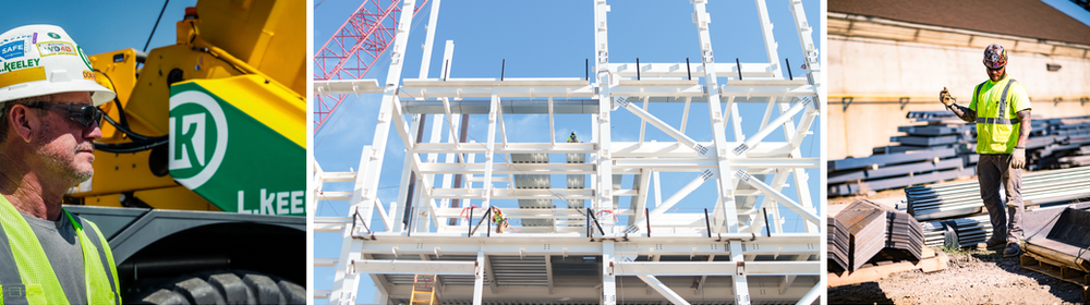 A man in a hard hat is standing in front of a construction site.