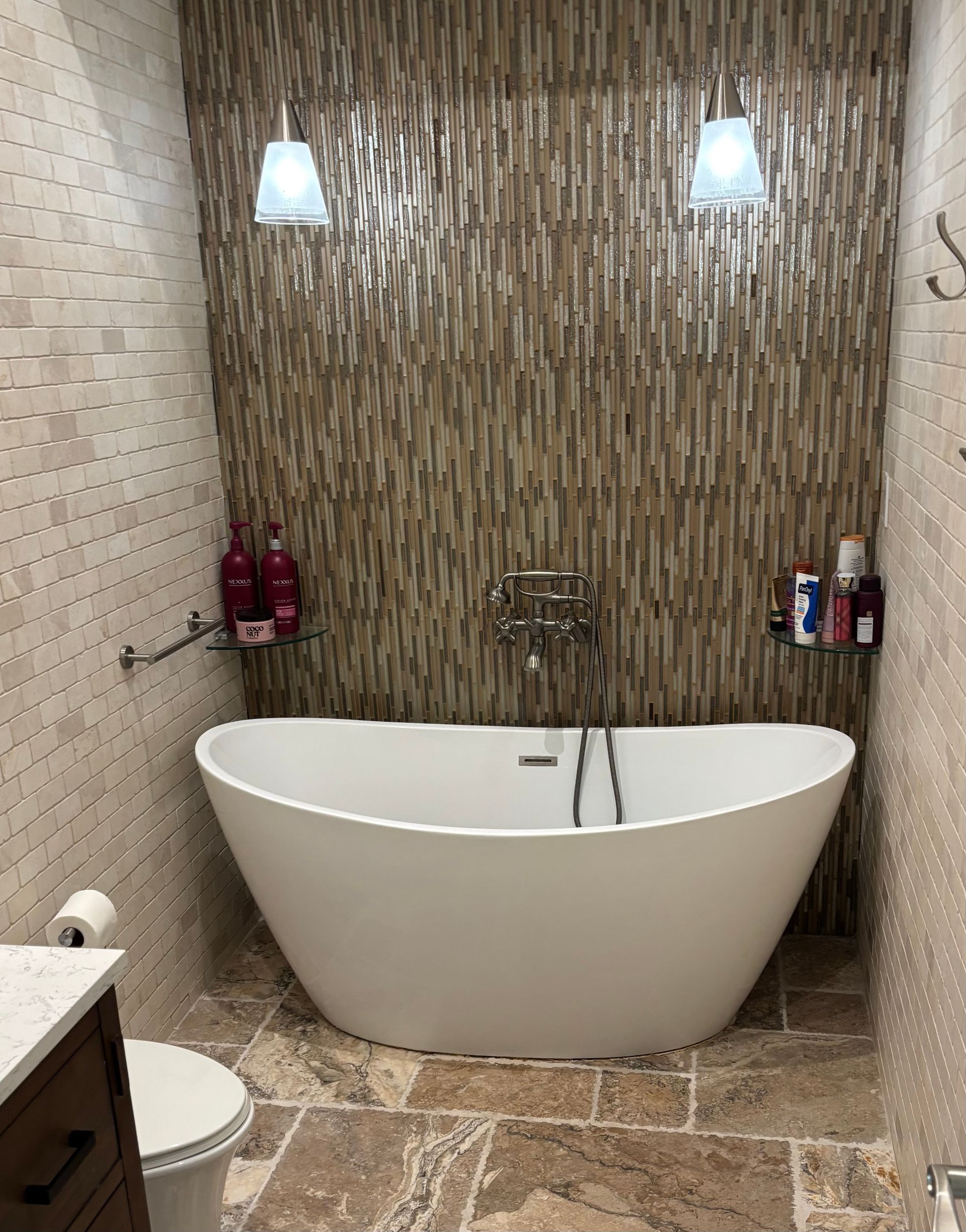A bathroom with a bathtub and a toilet.
