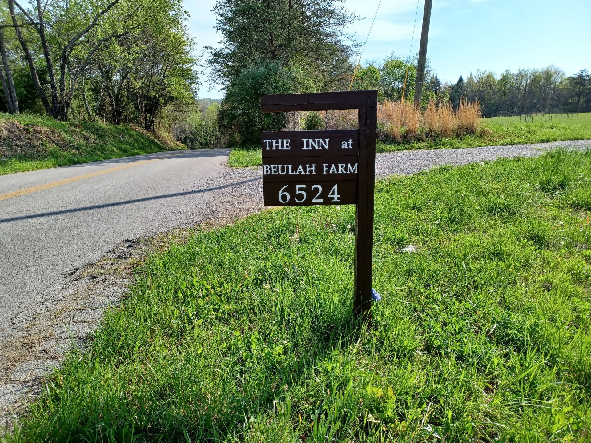 A brown rectangular sign reading
