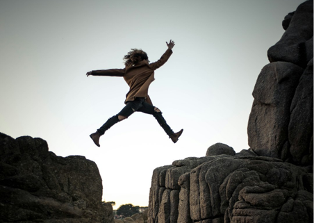 Person successfully jumping over a gap
