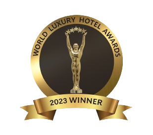 World Luxury Hotel Awards gold emblem with trophy and “2023 Winner” ribbon