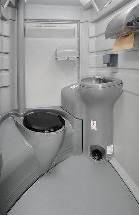 There is a toilet and a sink in the bathroom.