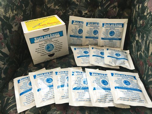 A box of bleach packets sits on a couch
