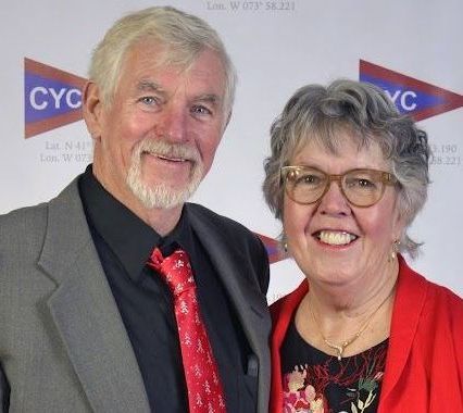 A man and a woman are posing for a picture.