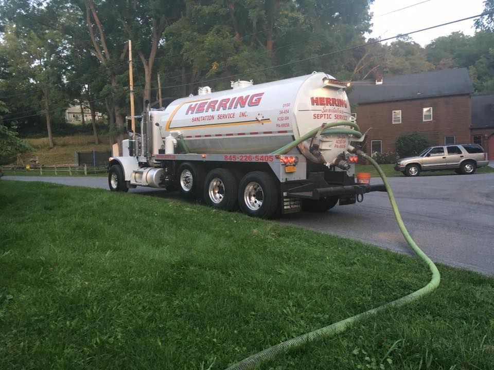 A herring septic tank is being filled with water