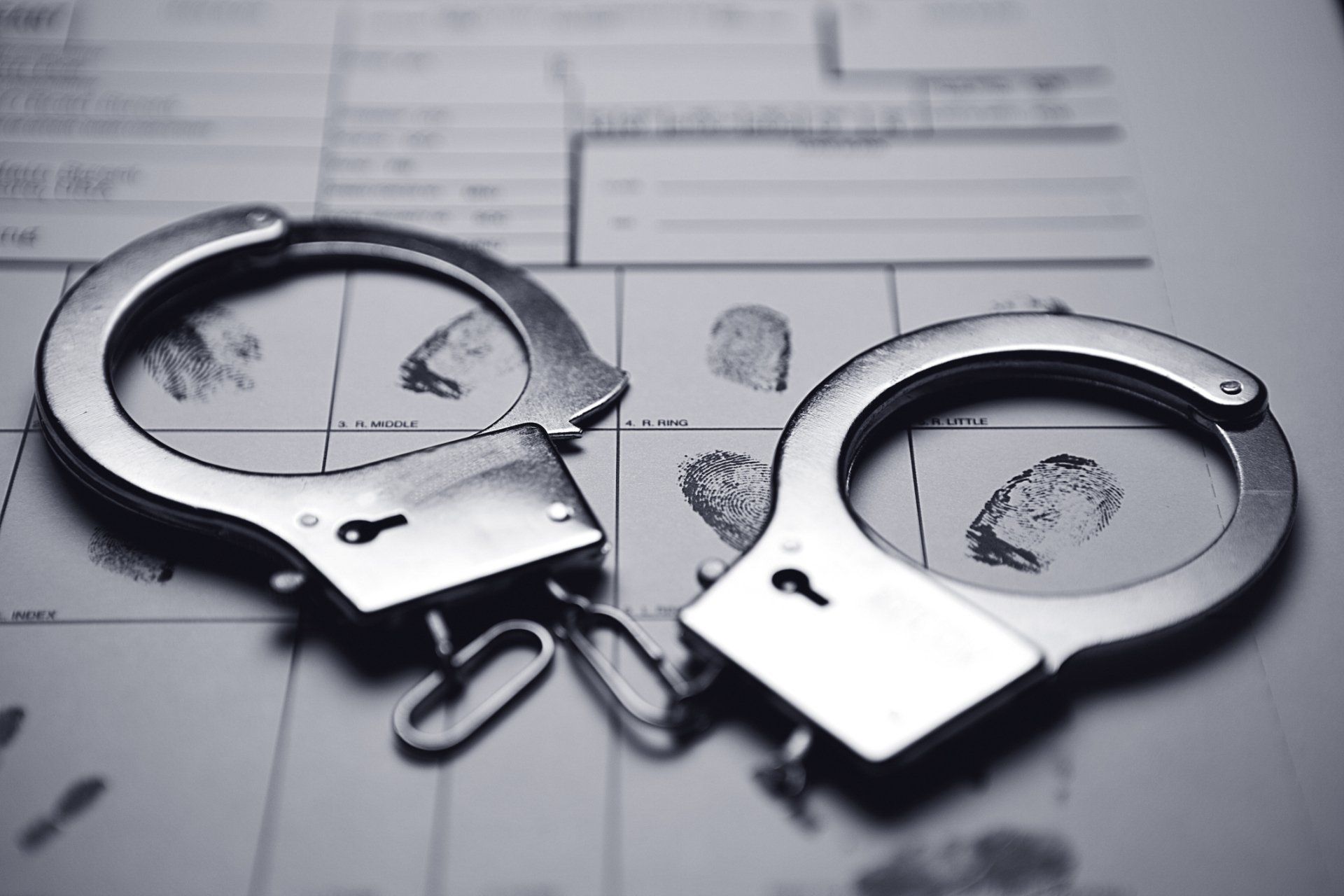 Black Handcuffs — Columbia, MO — Law Office of Mike Hamilton Black Handcuffs — Columbia, MO — Law Office of Mike Hamilton