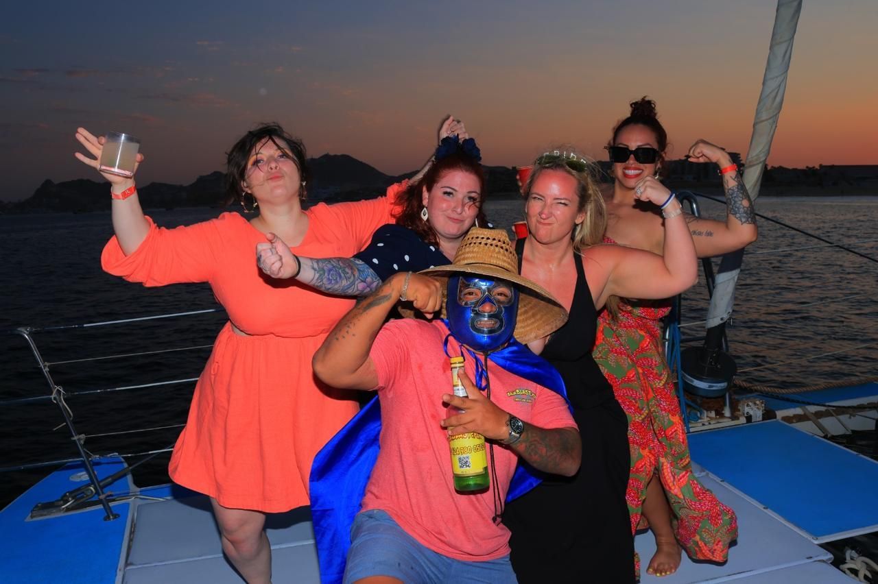 A group of people are posing for a picture on a boat.
