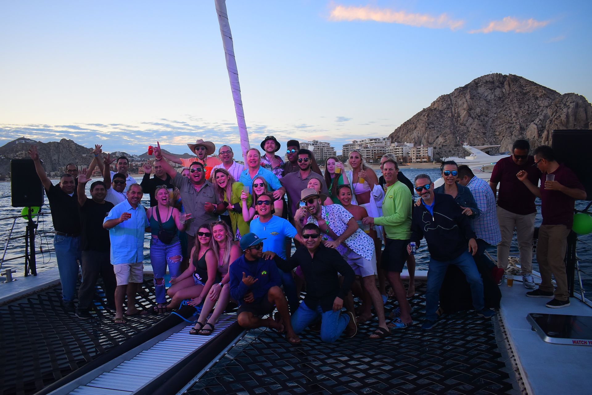 A group of people are posing for a picture on a boat.