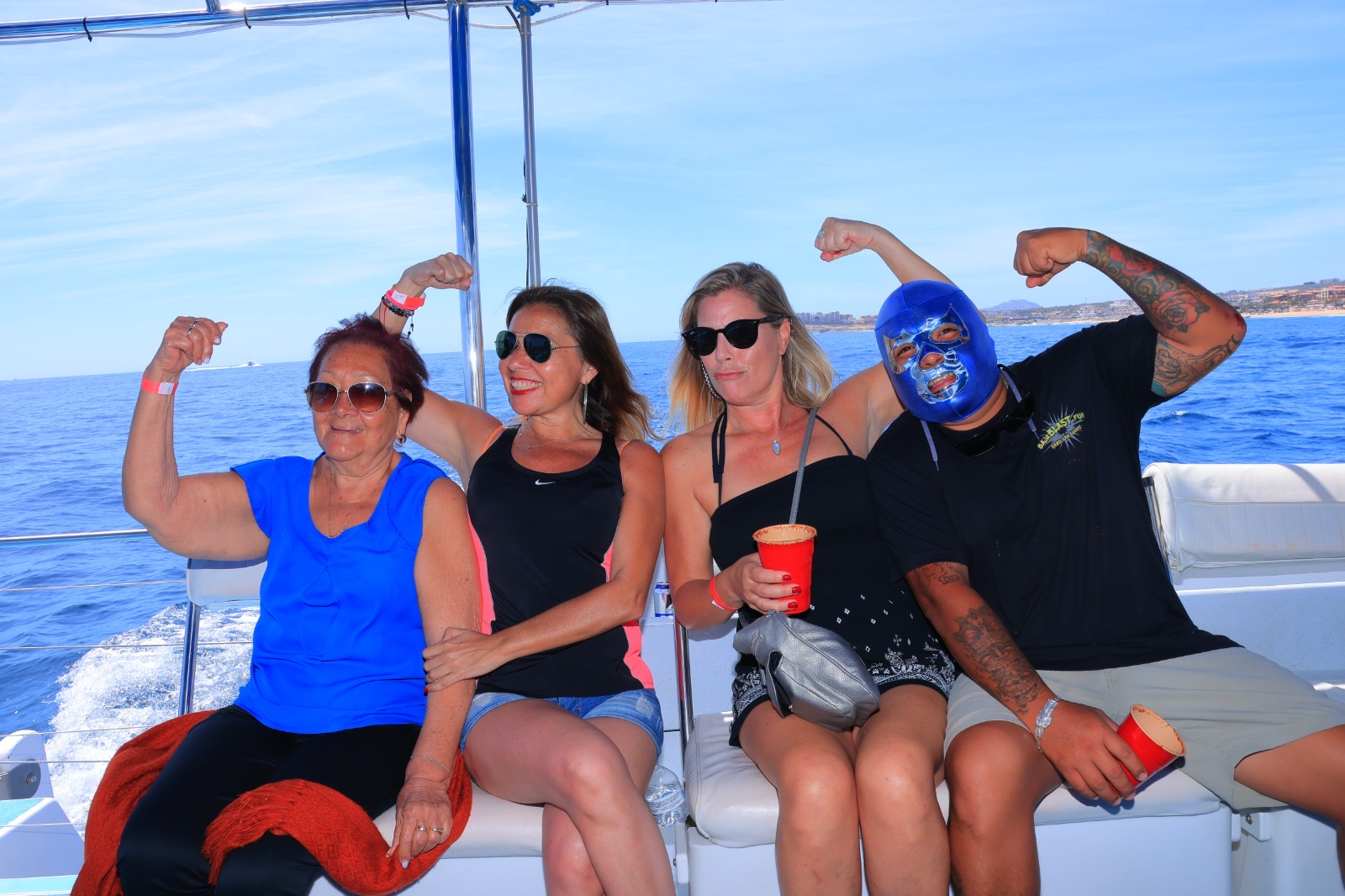 A group of people are posing for a picture on a boat.