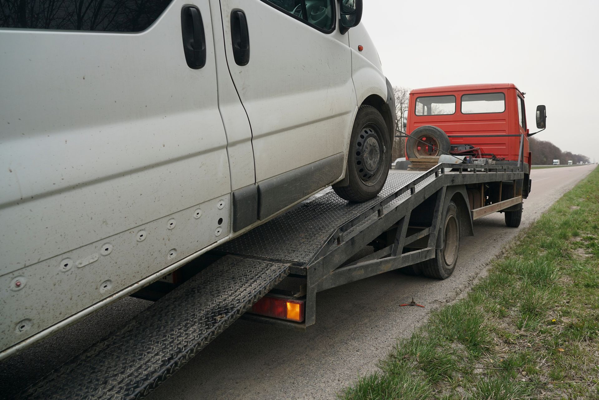 Loading a minibus onto a tow truck. 