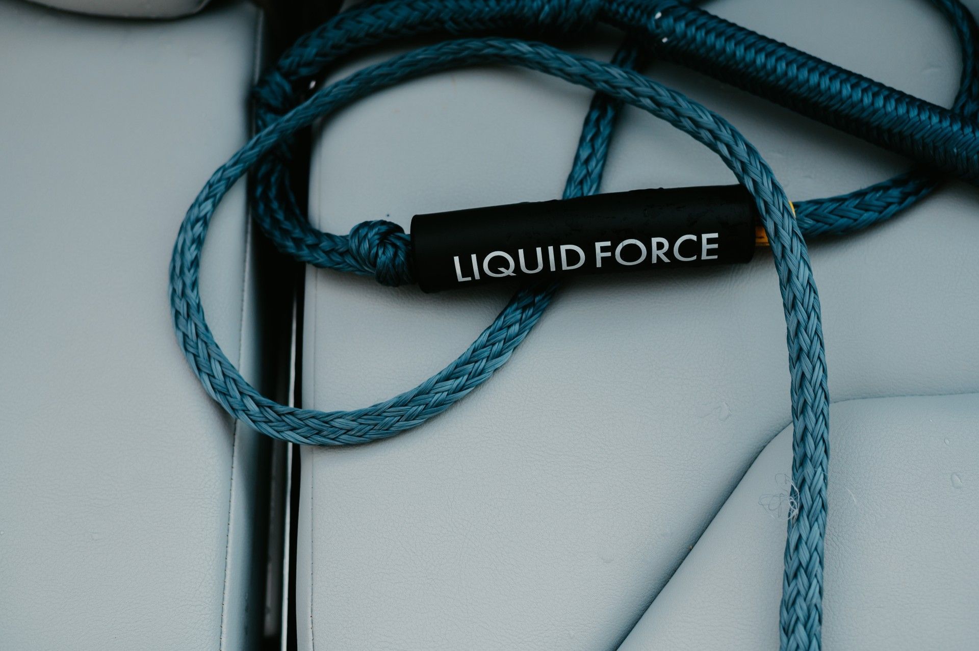 A blue rope with liquid force written on it