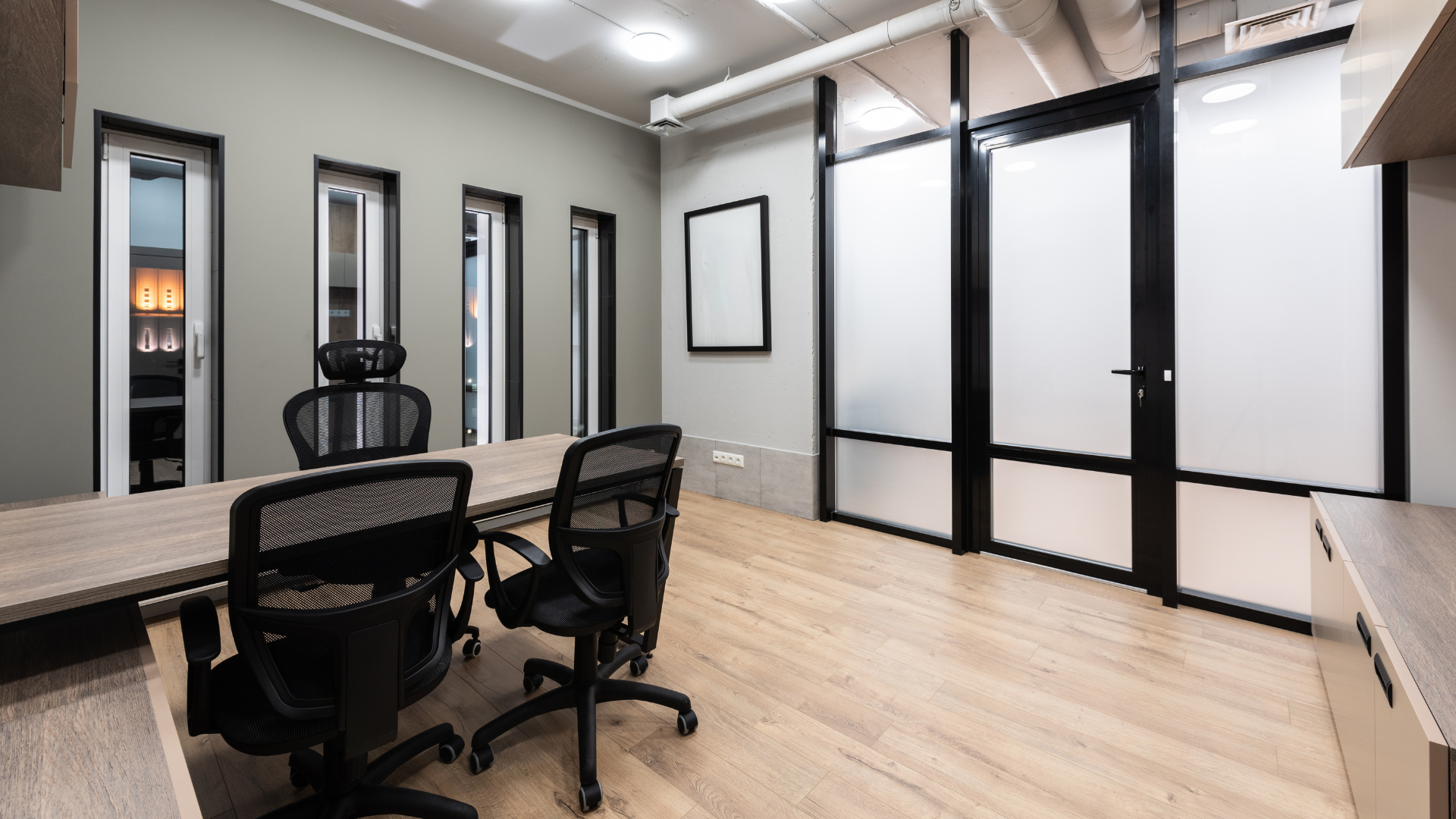 a conference room with a table and chairs in it.