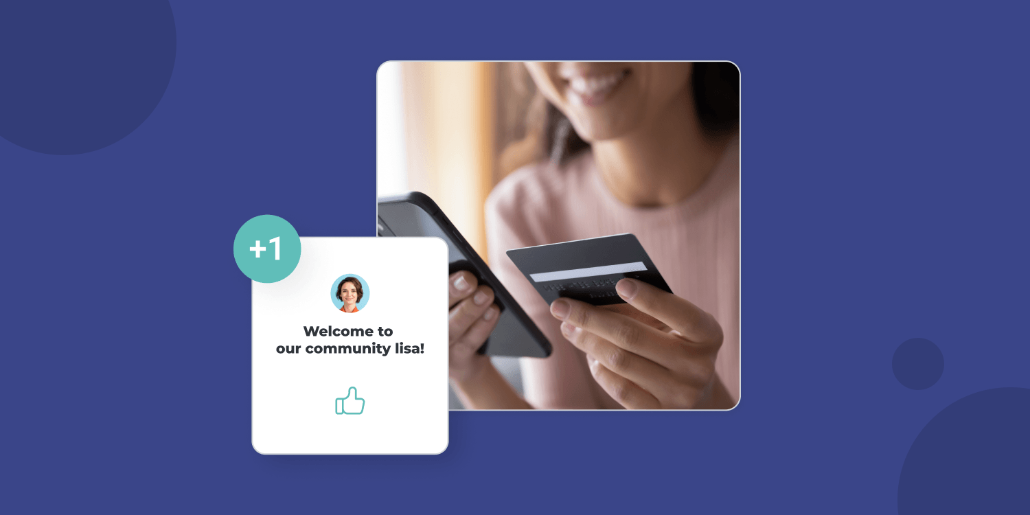 A woman holding a credit card over her phone and a pop up screen showing: 