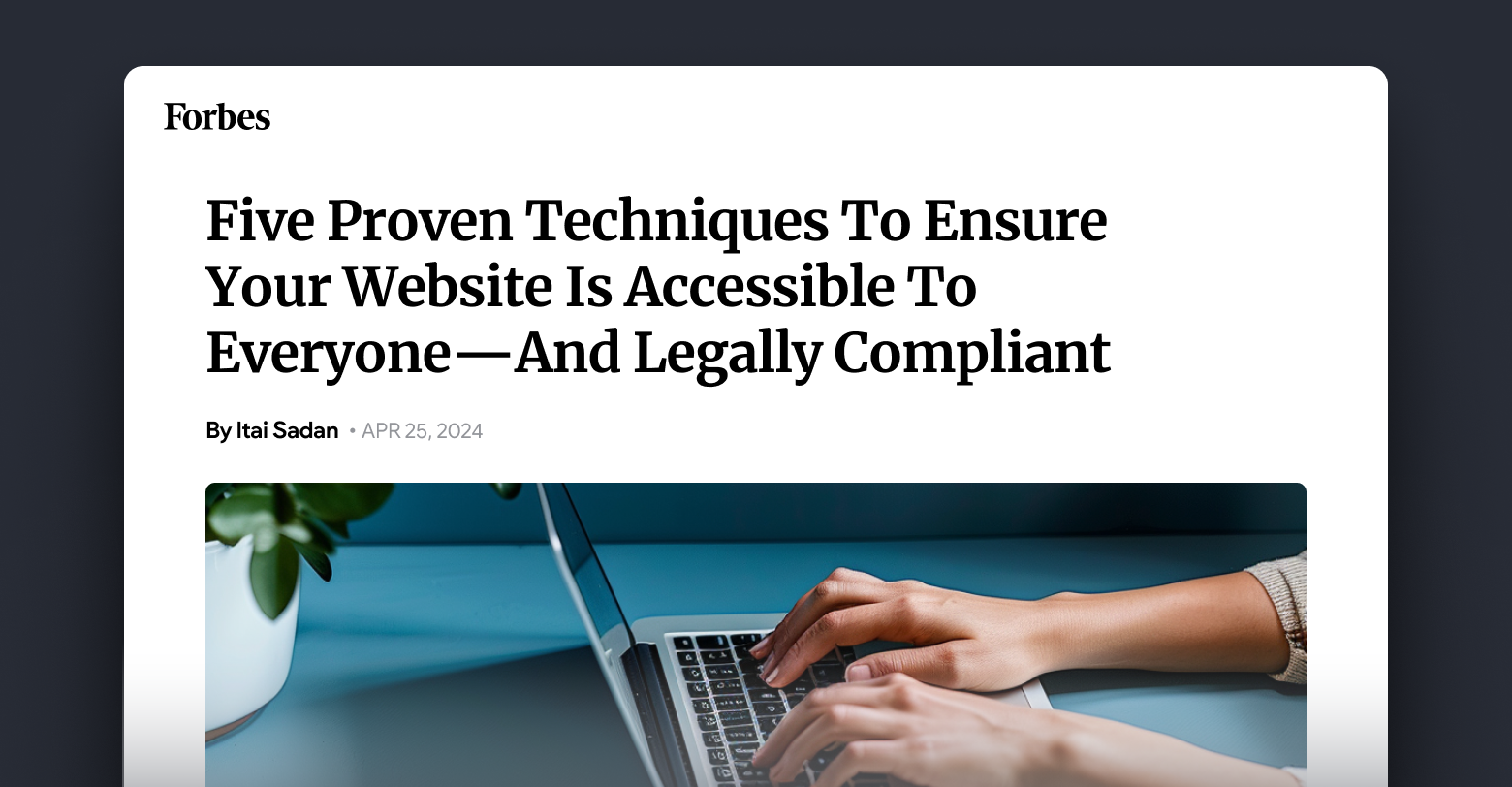 A person is typing on a laptop computer.