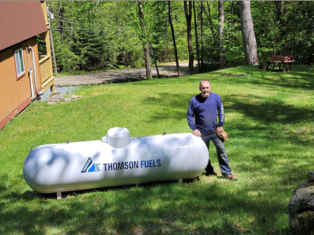 Man Beside The Fuel Tank — Bradford, VT — Thomson Fuels