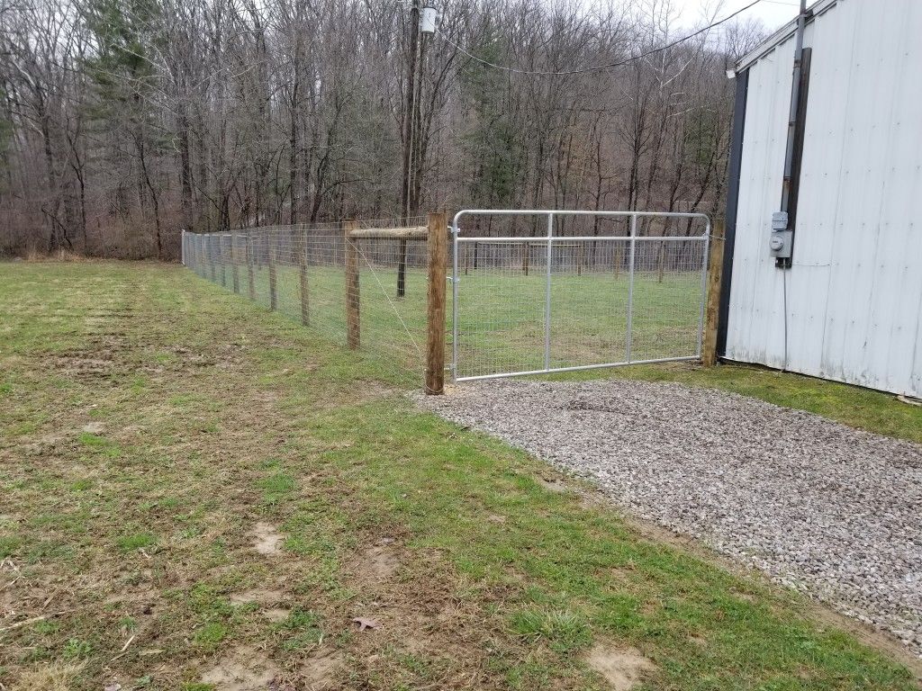 Fenced Area With A Gate And A Building Inside - Columbus, IN - Indiana Agricultural Fencing