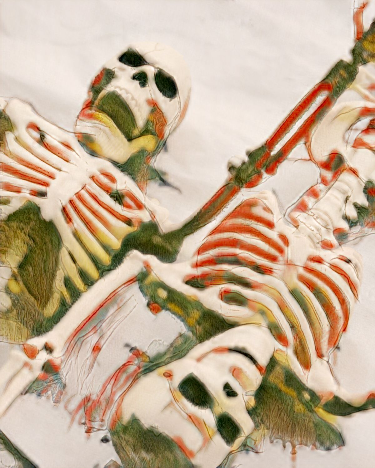 Two skeletons are laying on top of each other in the snow.