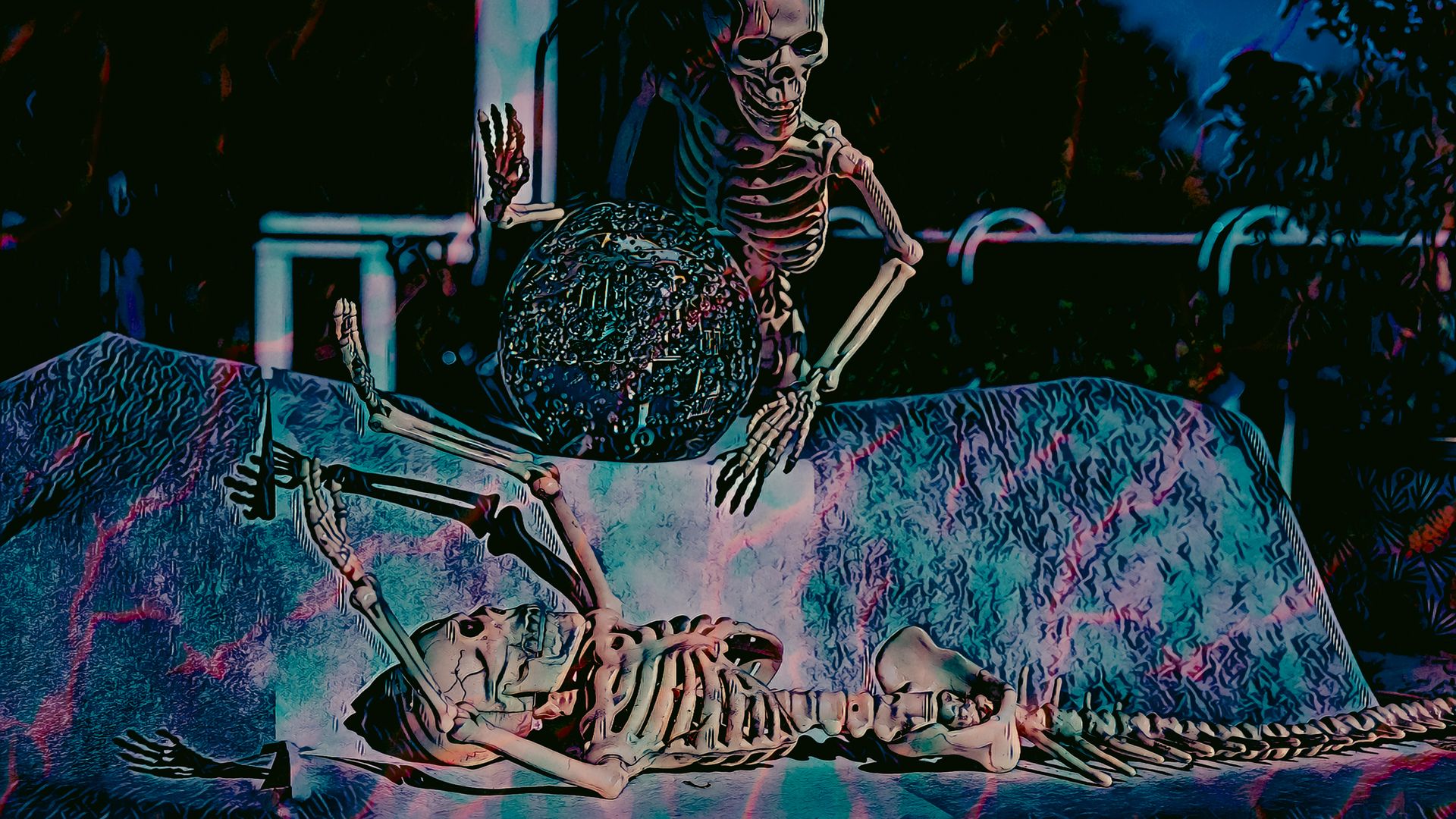 A skeleton is laying on top of another skeleton on a bed.