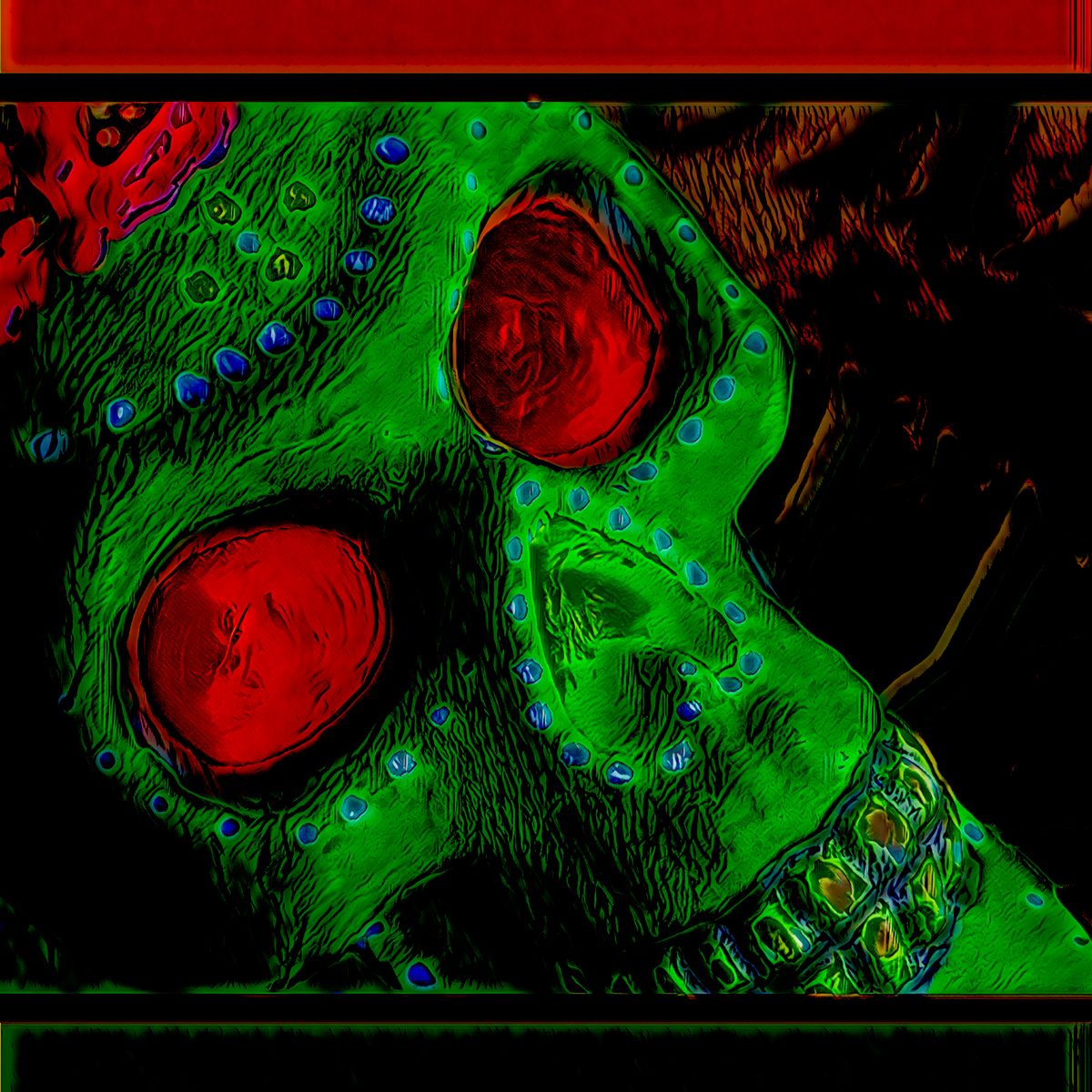 A green skull with red eyes is glowing in the dark.