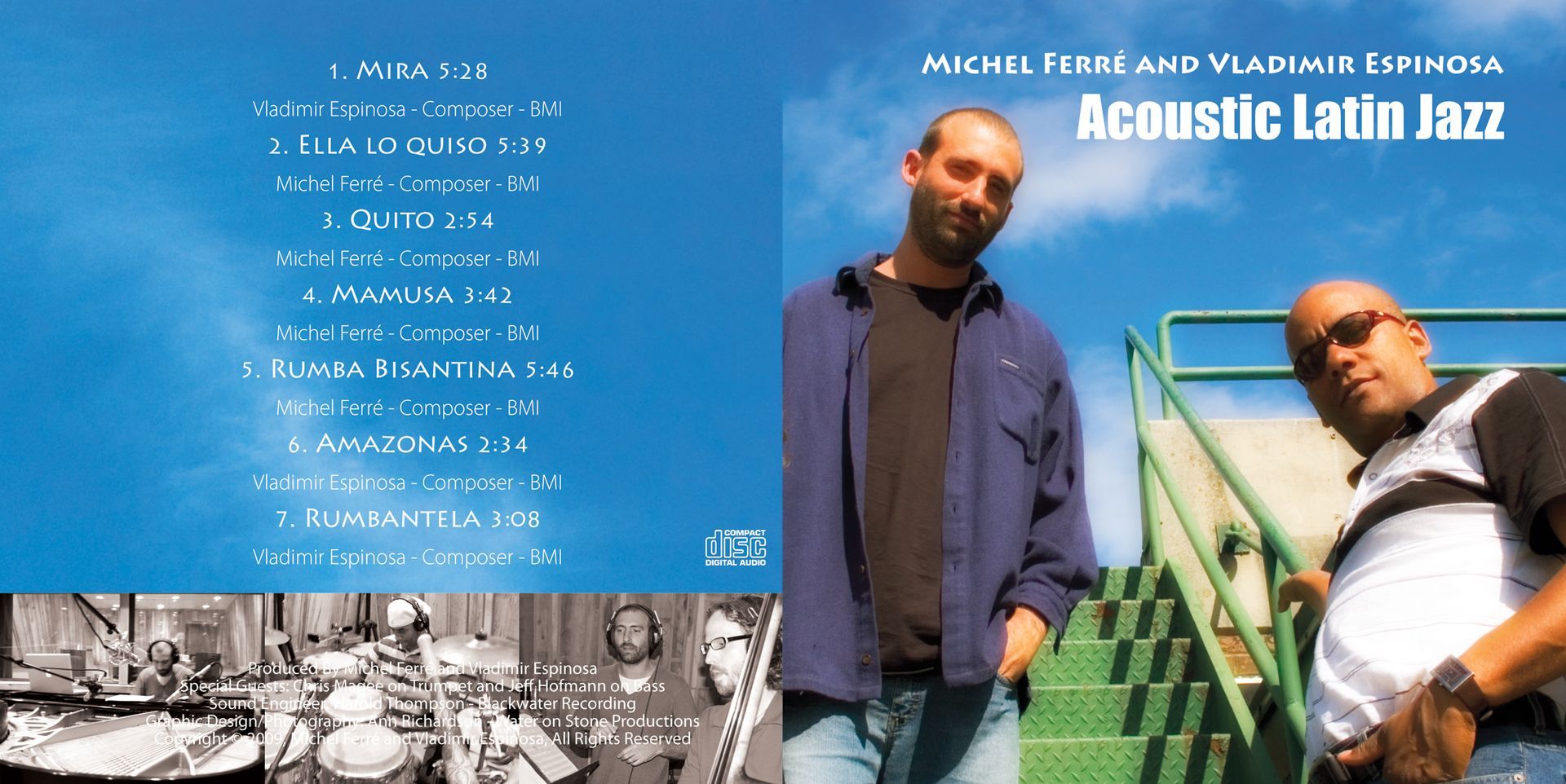 Two men are standing next to each other in front of a sign that says acoustic latin jazz