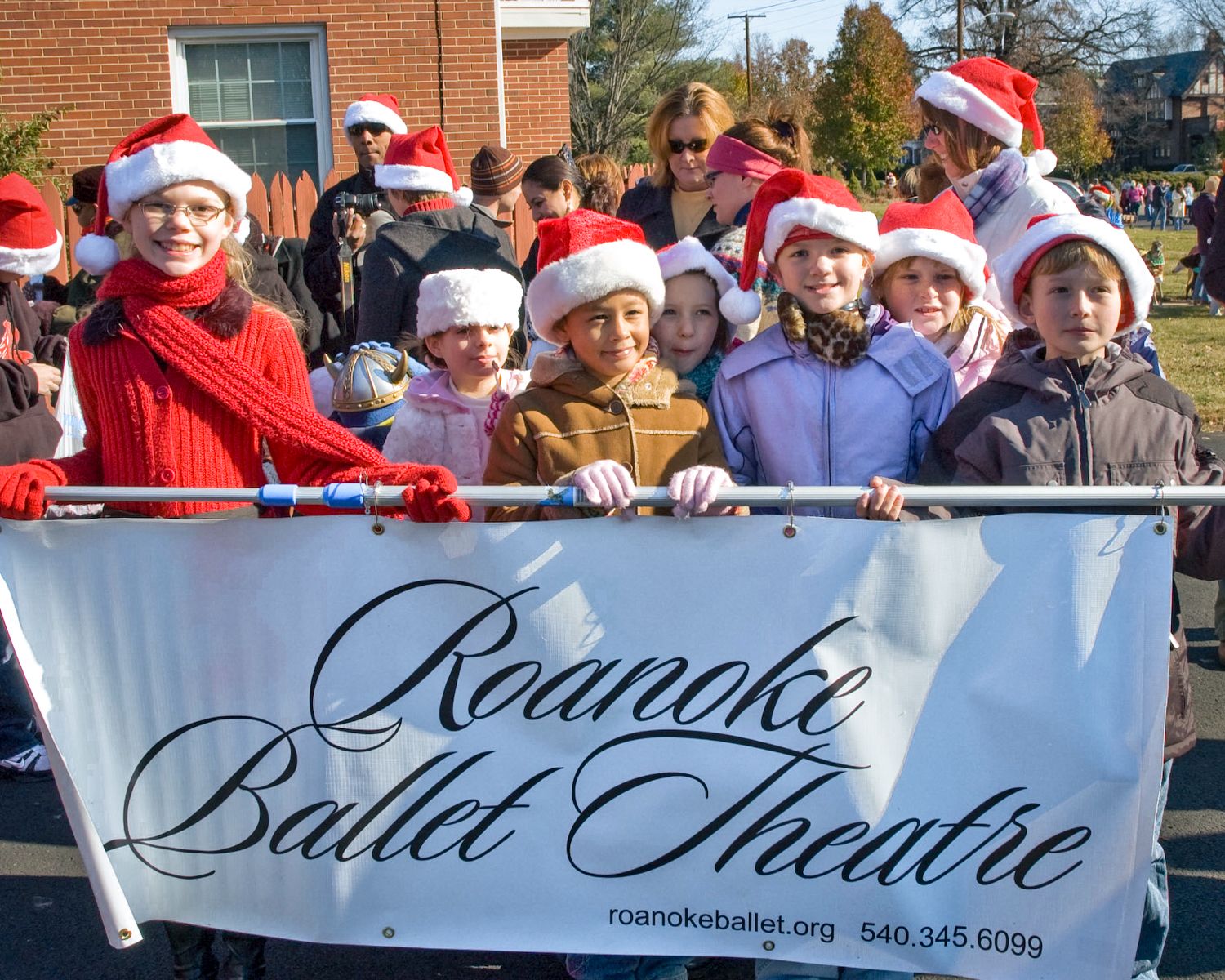 A group of children holding a banner for the roanoke ballet theatre