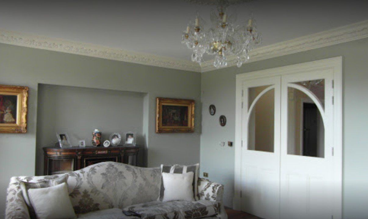 A picture of a living room painted in white and sage green by Painters and Decorators Southampton