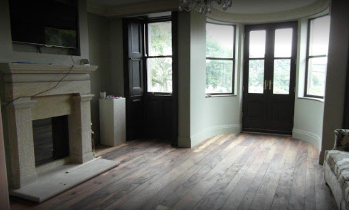 A picture of a large living room painted in white and anthracite by Painters and Decorators Southampton