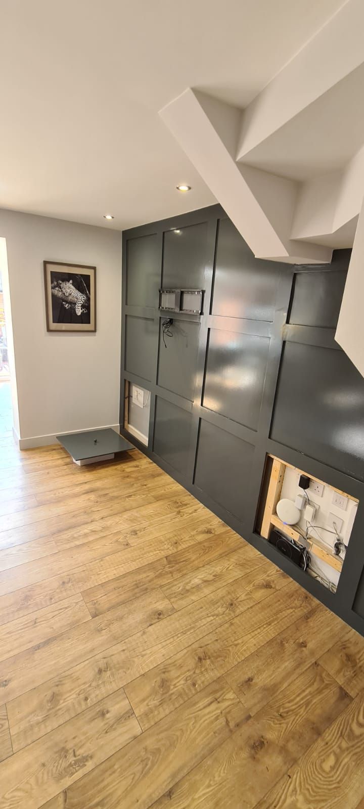 A picture of wood panelling painted in dark green by Painters and Decorators Southampton