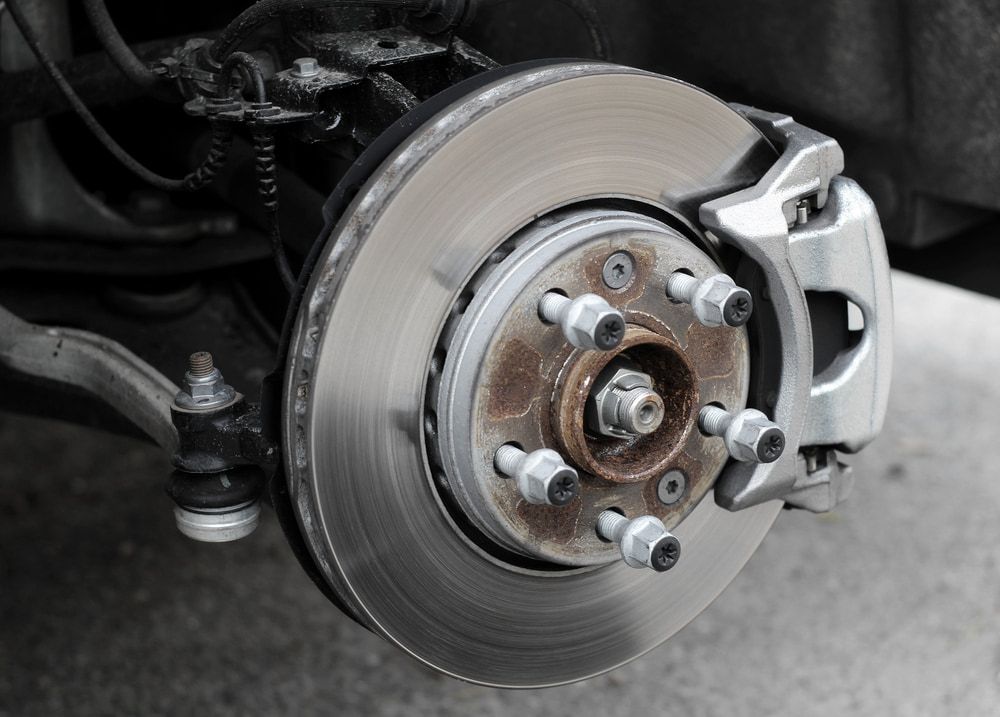 A Close Up of a Brake Disc on a Car — Nationwide Auto Service Centre in West Gosford, NSW