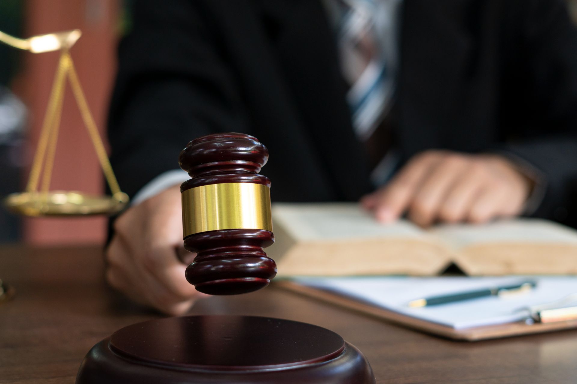 An attorney with a gavel on a table.
