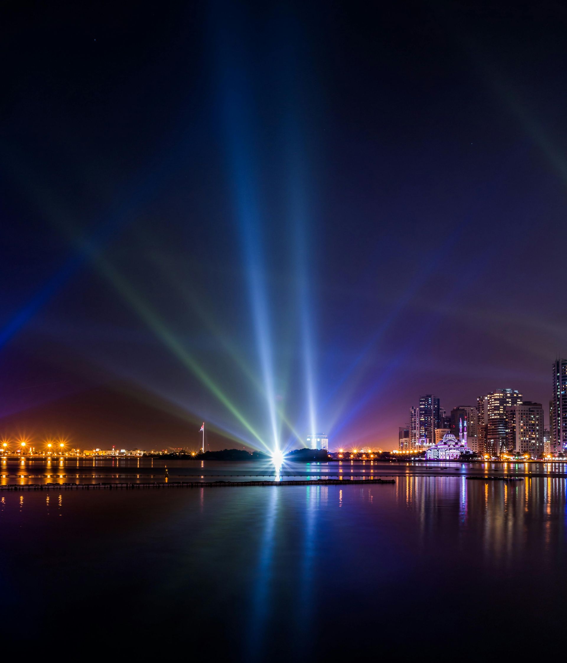 Spotlights over water.