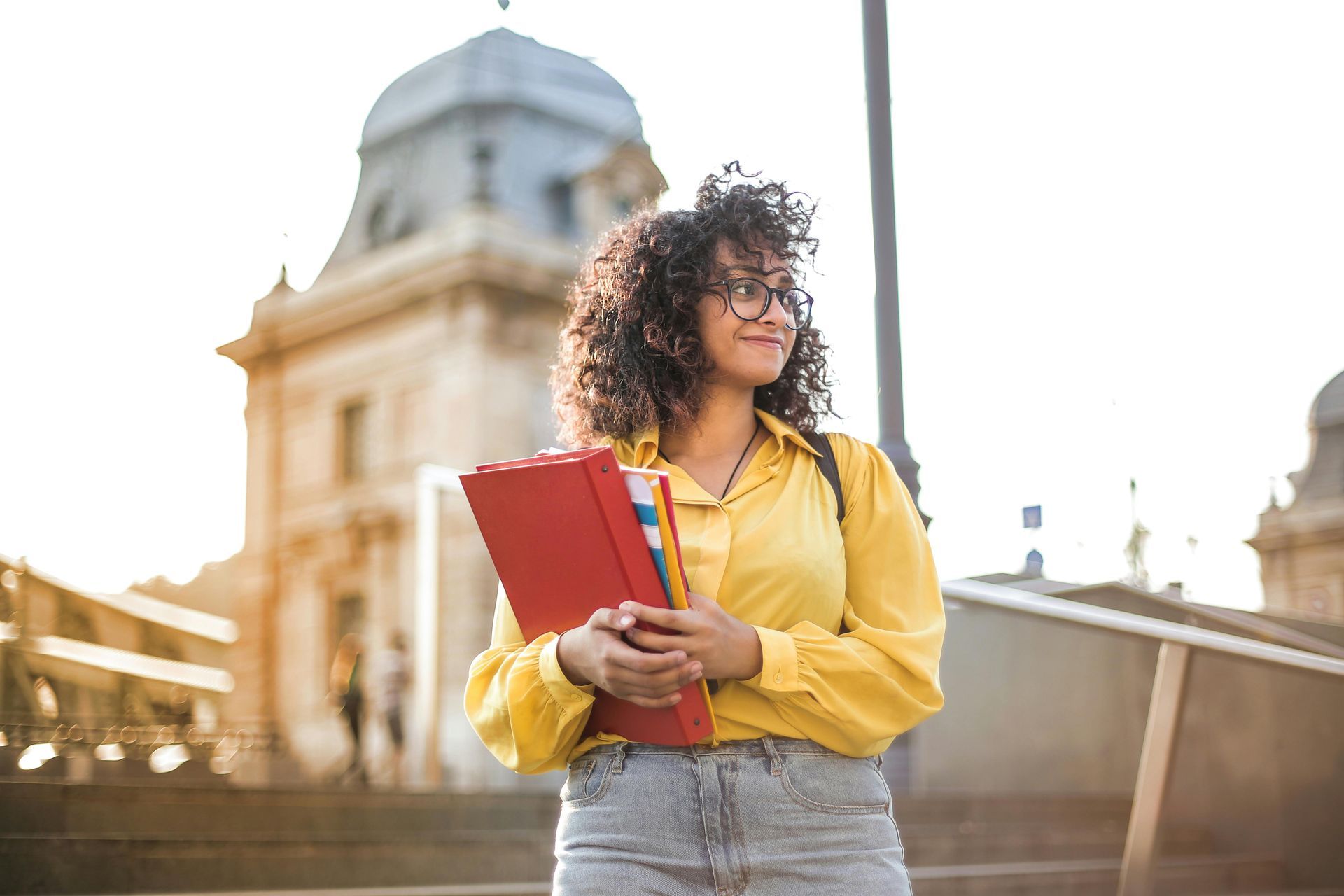 Women in Yellow Jacket Holding Books