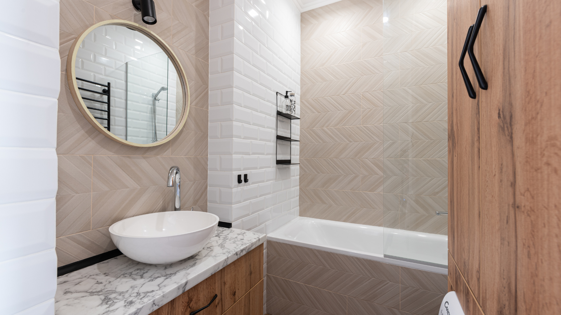 A bathroom with a sink , bathtub and mirror.