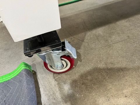 Handles drilling machine comes on wheels for portability in shop