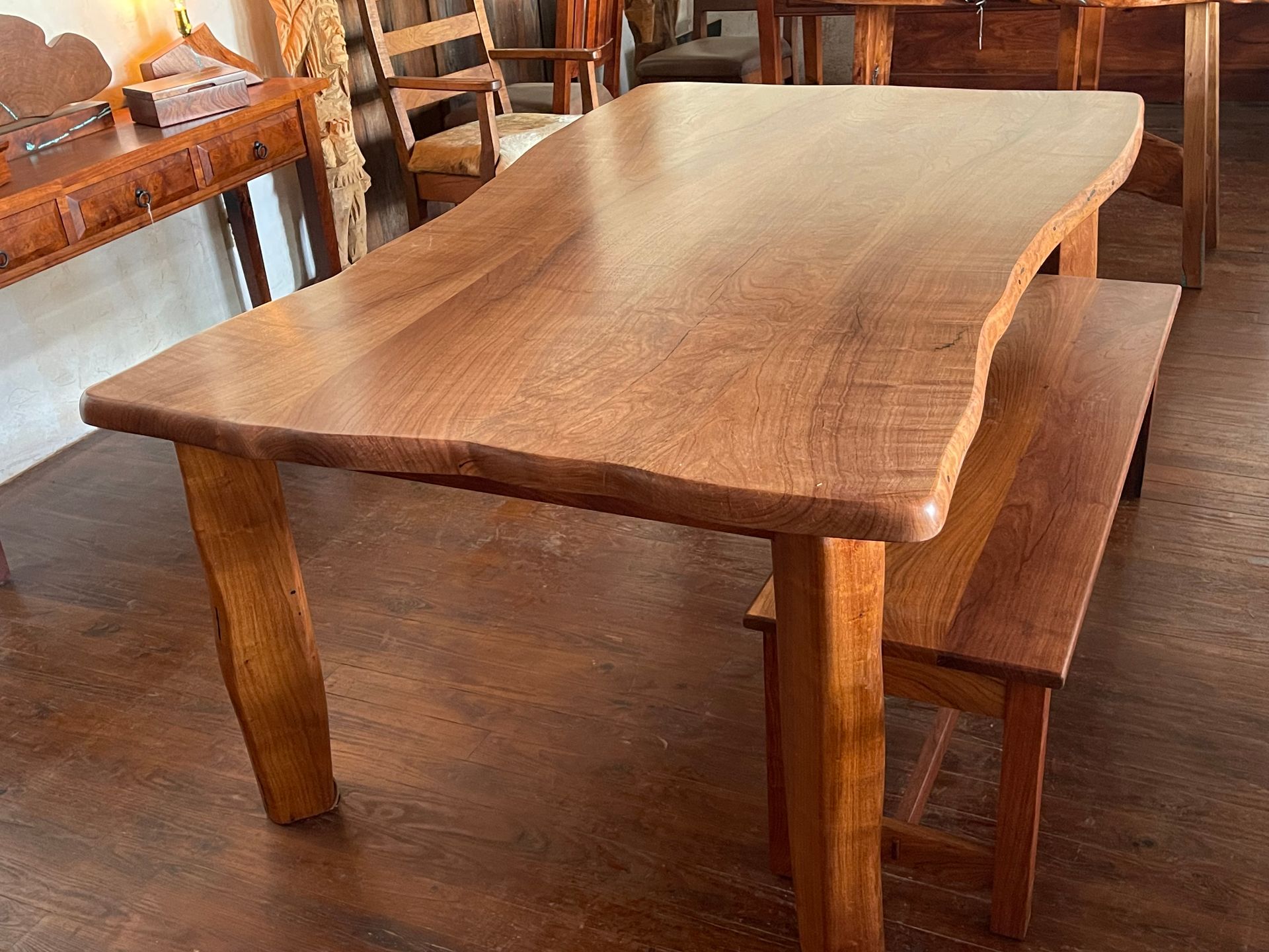 Wooden dining table and bench in a rustic room