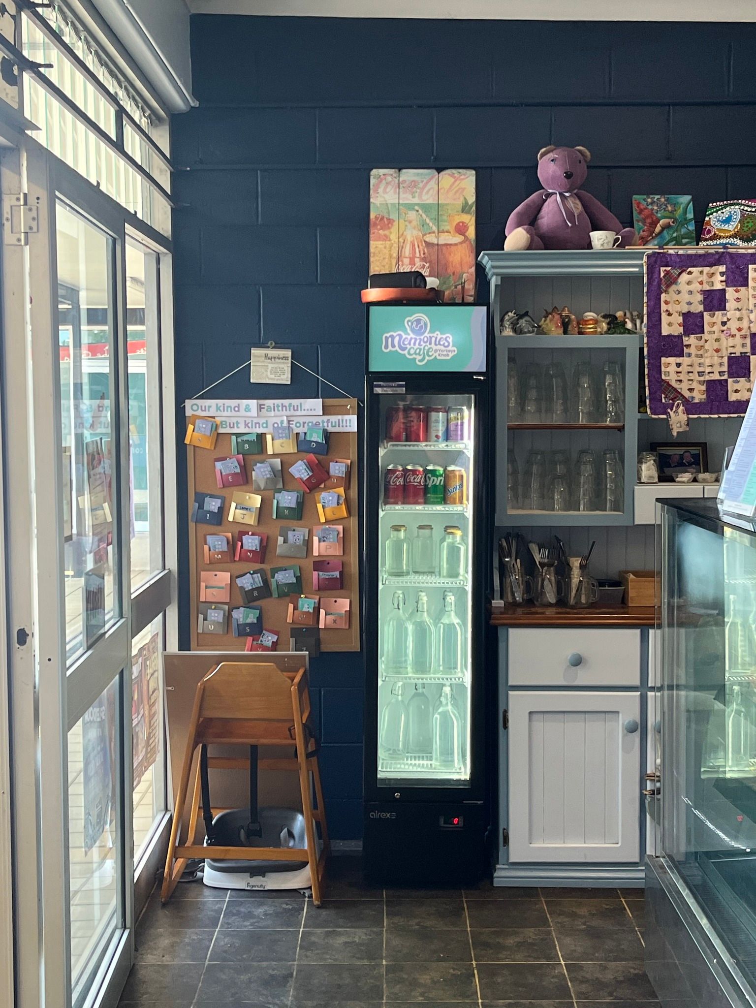 Interior Cafe Corner With a Drink Fridge, Shelves — Memories Cafe @ Yorkeys Knob in Yorkeys Knob, QLD