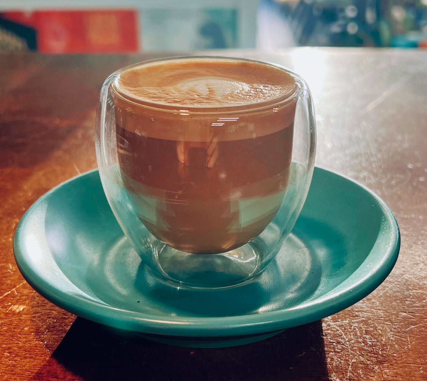 Espresso in a Double-walled Glass on a Teal Saucer — Memories Cafe @ Yorkeys Knob in Yorkeys Knob, QLD