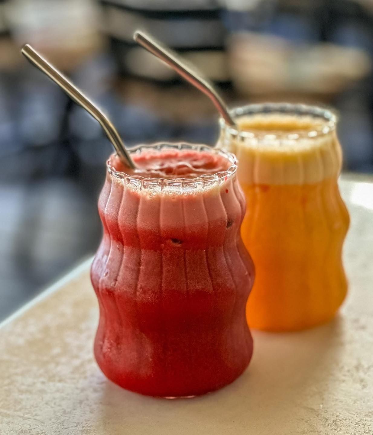 Two Glasses of Juice With Metal Straws — Memories Cafe @ Yorkeys Knob in Yorkeys Knob, QLD