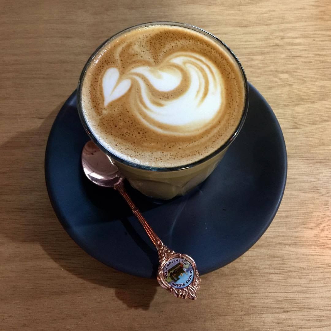 A Cup of Coffee on a Saucer With a Spoon — Memories Cafe @ Yorkeys Knob in Yorkeys Knob, QLD