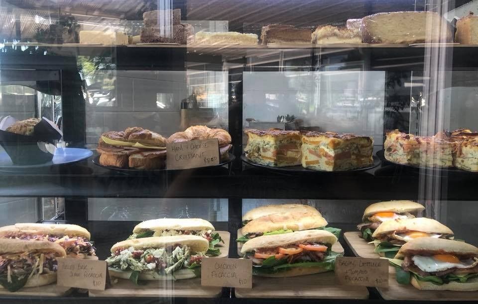 A Display Case Filled With a Variety of Sandwiches And Pastries — Memories Cafe @ Yorkeys Knob in Yorkeys Knob, QLD