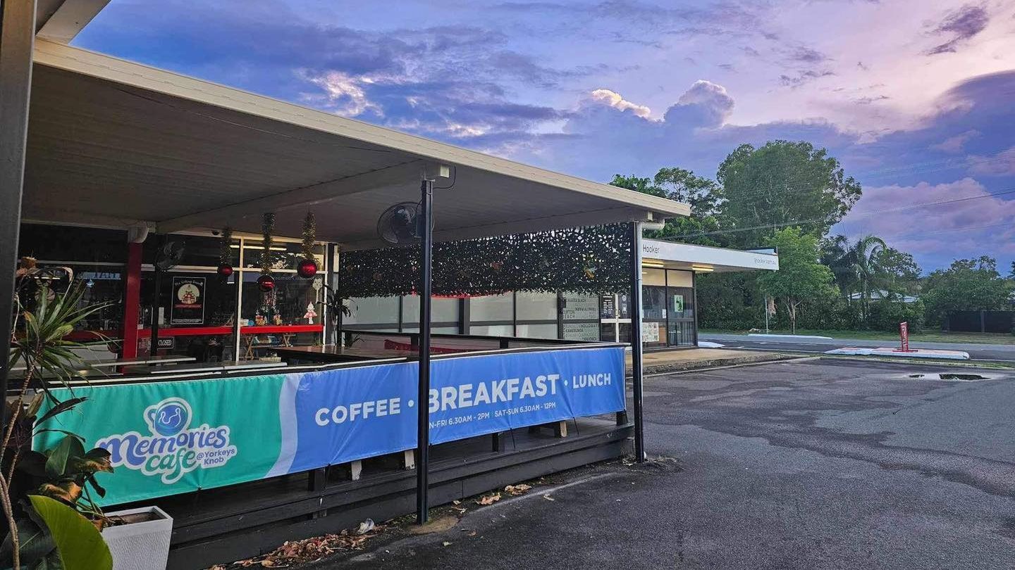 A Group of People Are Playing Instruments in a Cafe — Memories Cafe @ Yorkeys Knob in Yorkeys Knob, QLD