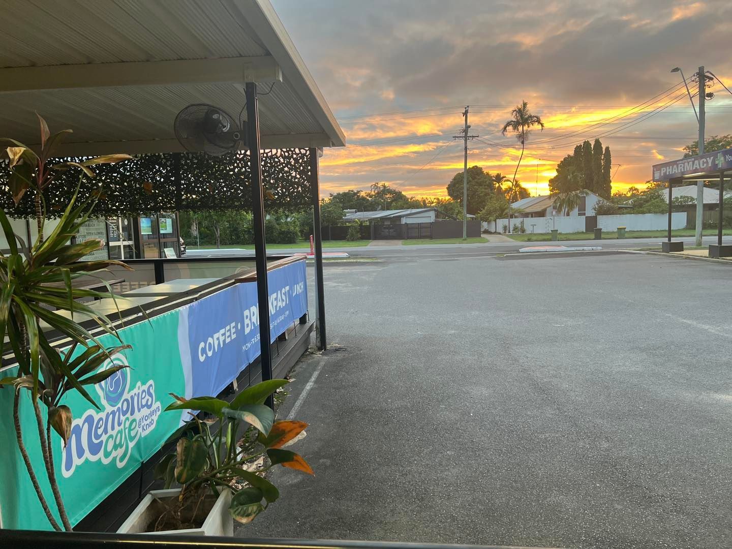 A Group of People Are Sitting Outside of a Cafe — Memories Cafe @ Yorkeys Knob in Yorkeys Knob, QLD