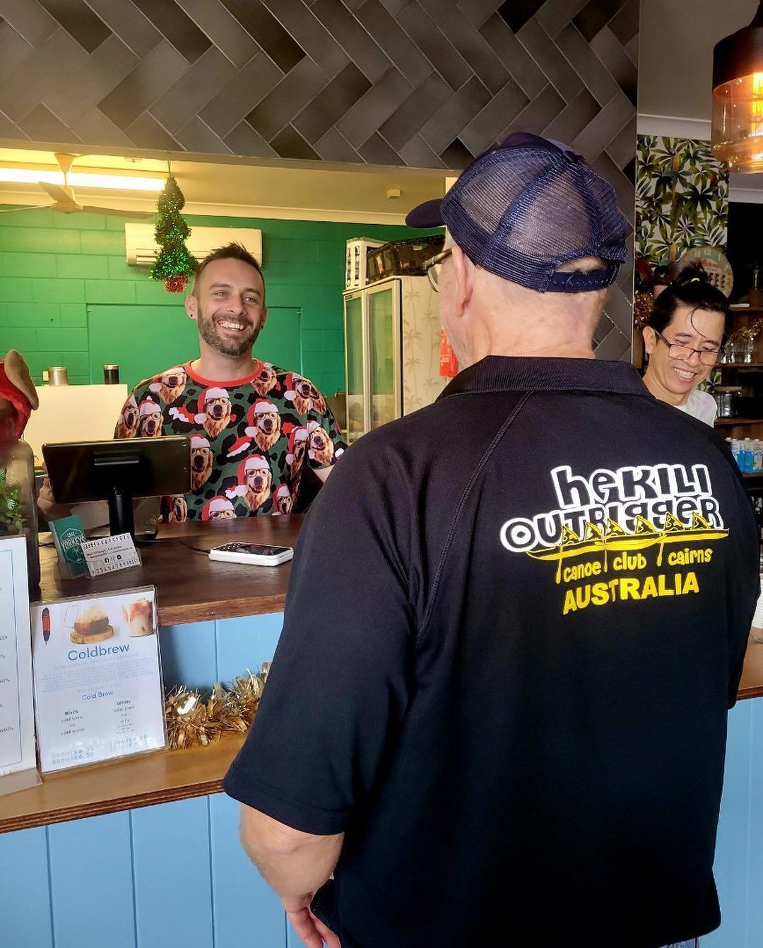 Man in Shirt at Cafe Counter — Memories Cafe @ Yorkeys Knob in Yorkeys Knob, QLD