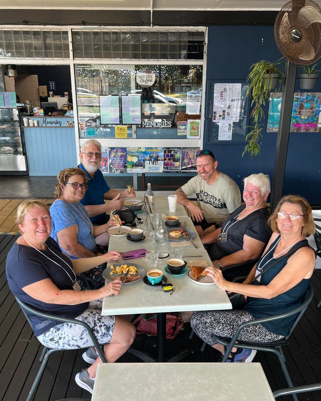Six People at an Outdoor Cafe Table Enjoying Drinks and Food — Memories Cafe @ Yorkeys Knob in Yorkeys Knob, QLD