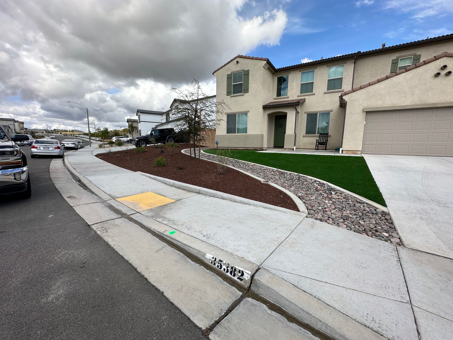 A house with a lot of cars parked in front of it