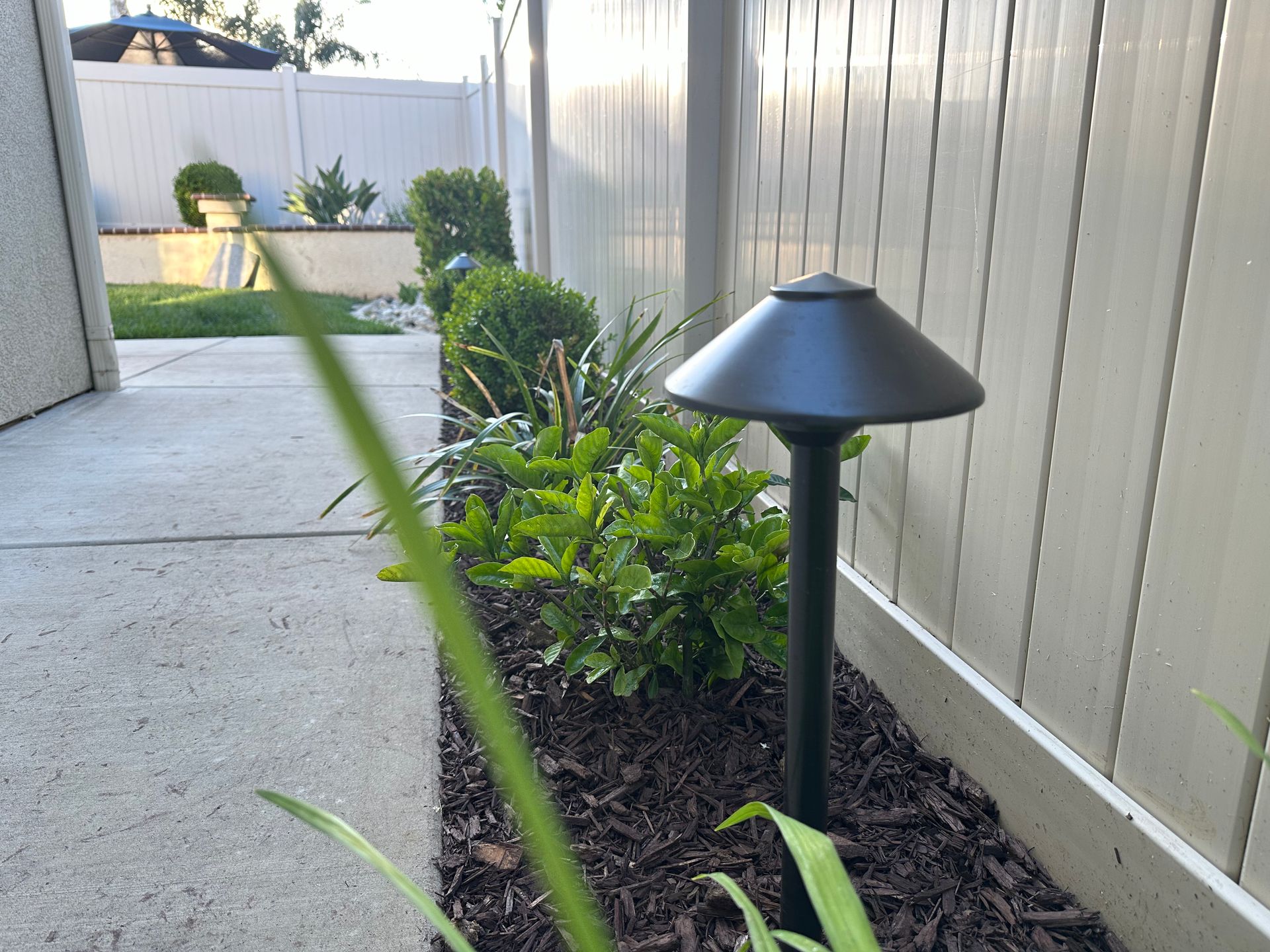 A fence with a light in the middle of it