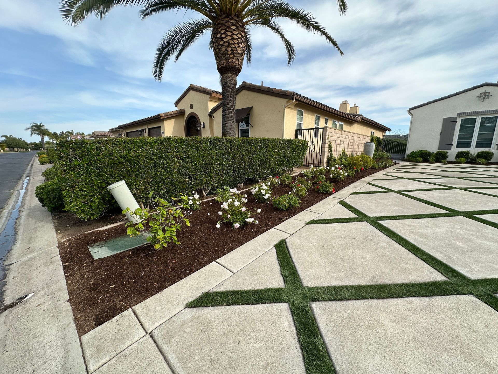 A large house with a palm tree in front of it.