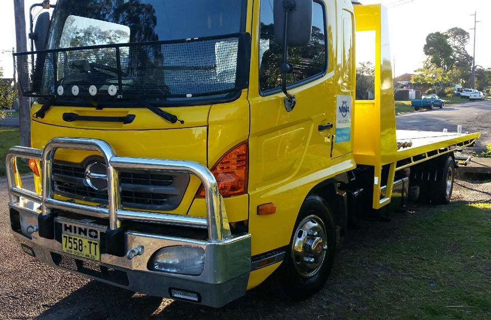 A Yellow Tow Truck — Wyong and Tuggerah Towing Service in Erina, NSW