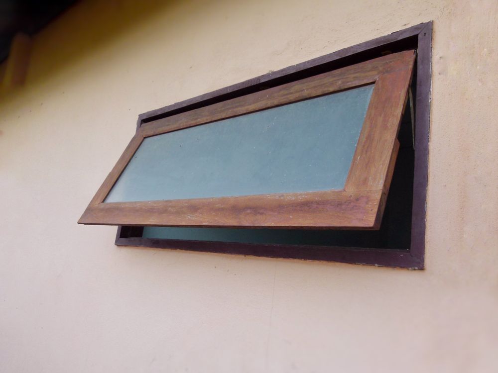 Opened, Wooden-framed Window in a Beige Wall — Sams Glass Solutions in Proserpine, QLD