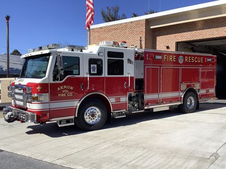 Akron's Rescue Engine 12-2  parked in front of the fire station.